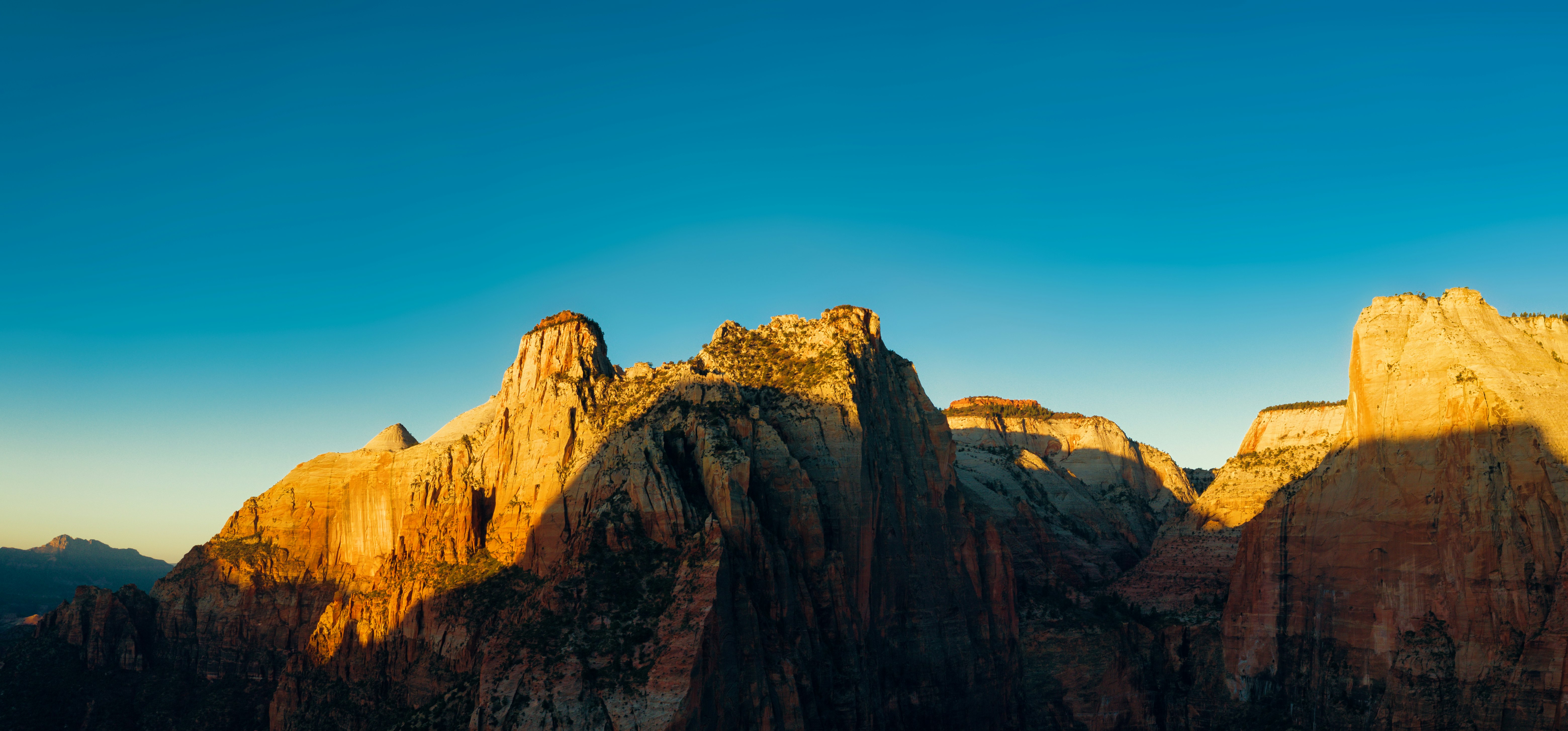 brown rocky mountain under blue sky during daytime